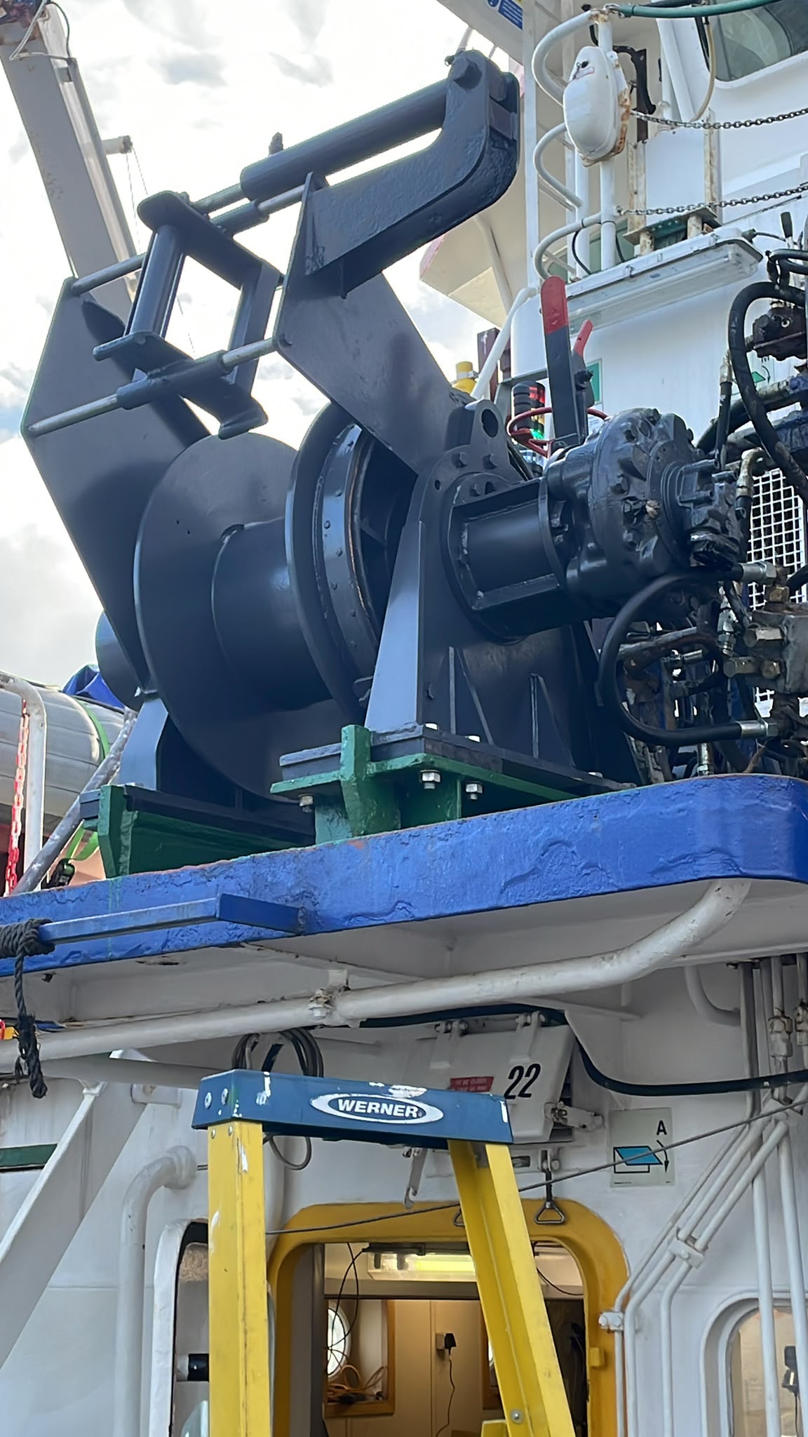 A large winch, aboard the research vessel named Prince Madog.