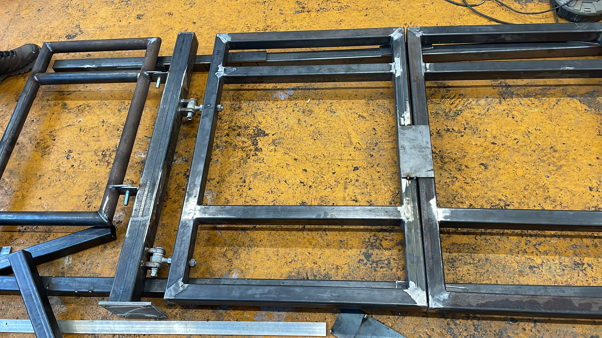 A stainless steel guard rail and gate, newly fabricated and welded.